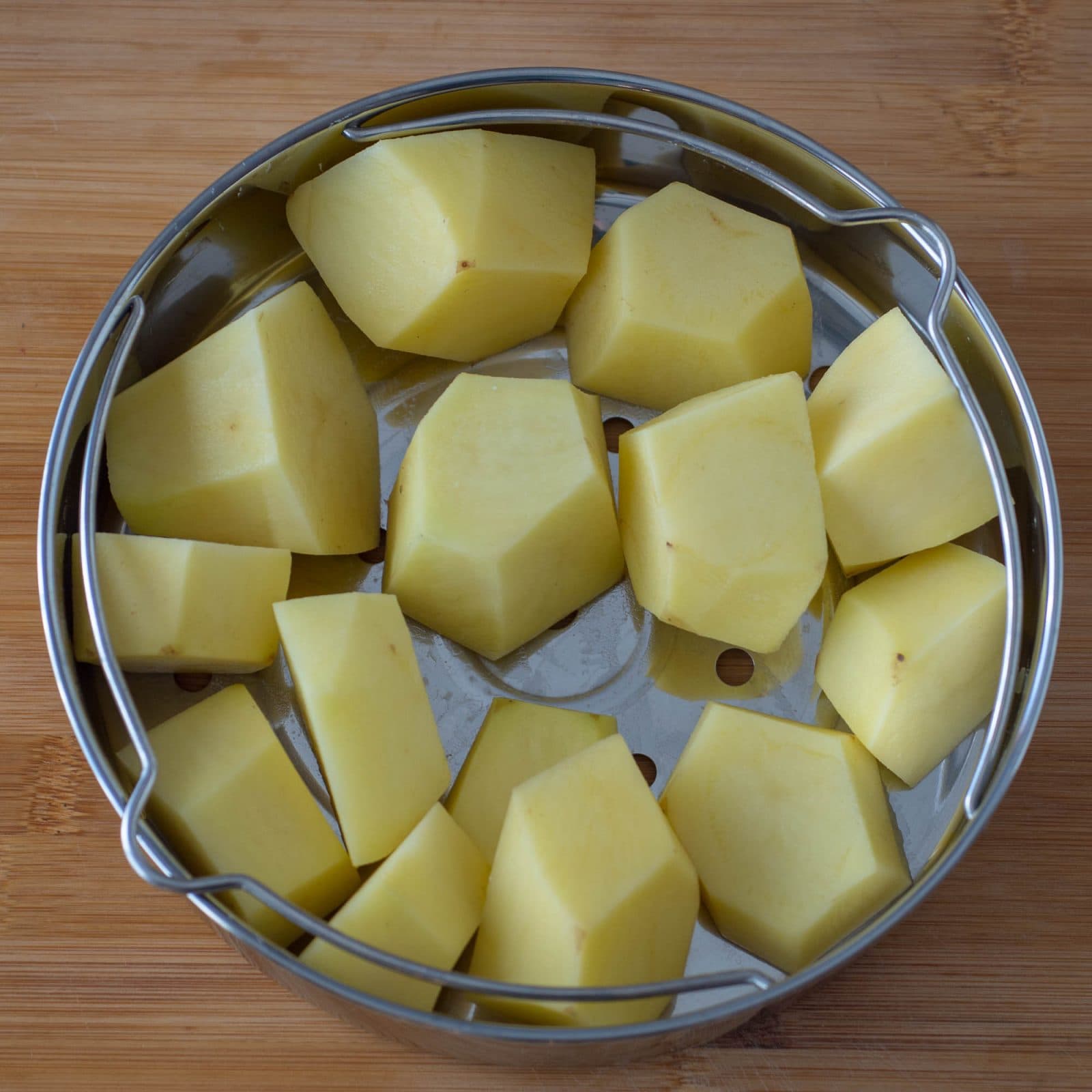 Mashed potatoes in steamer basket for Instant Pot pressure cooker