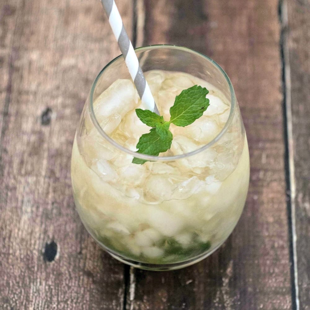 Mint leaves and ice make a refreshing Mint Julep recipe.