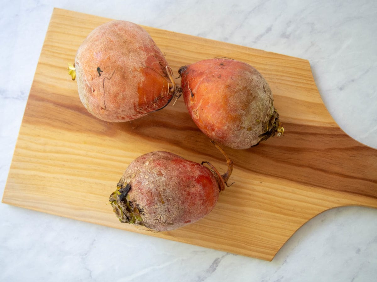 golden beets on a cutting board
