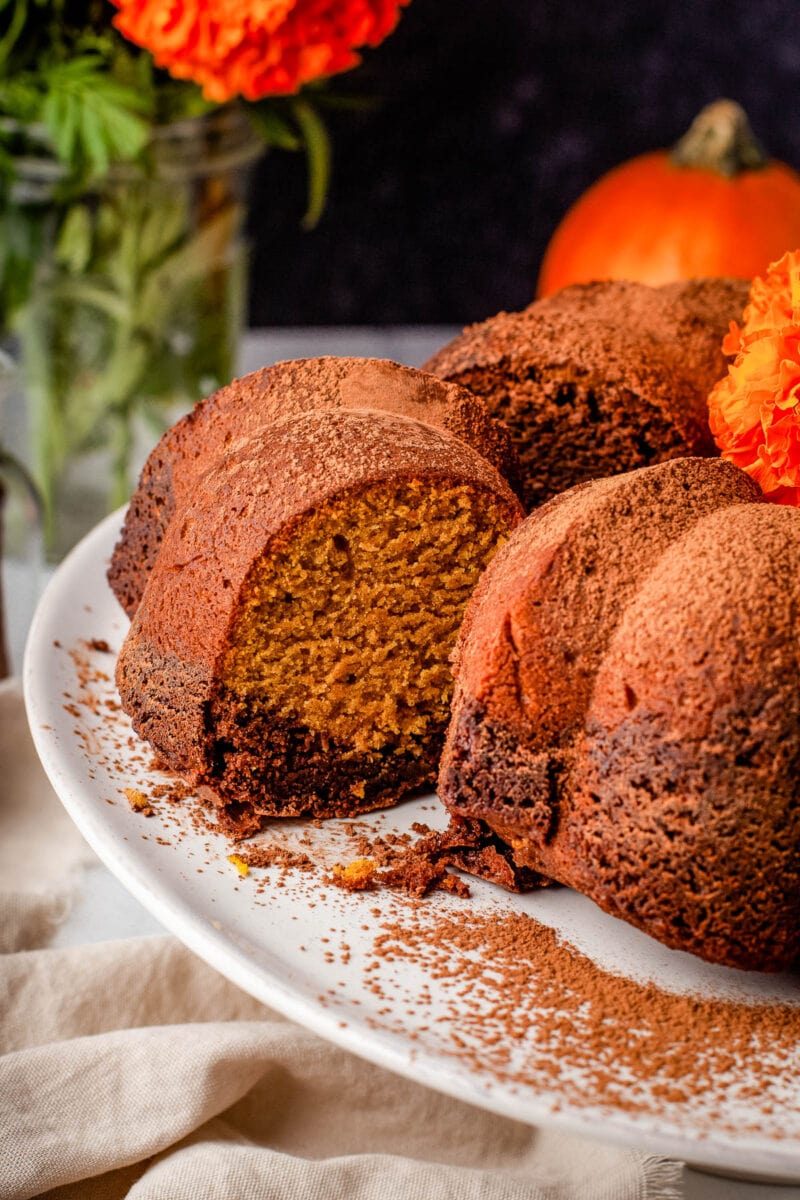 pumpkin chocolate cake with a slice cut out