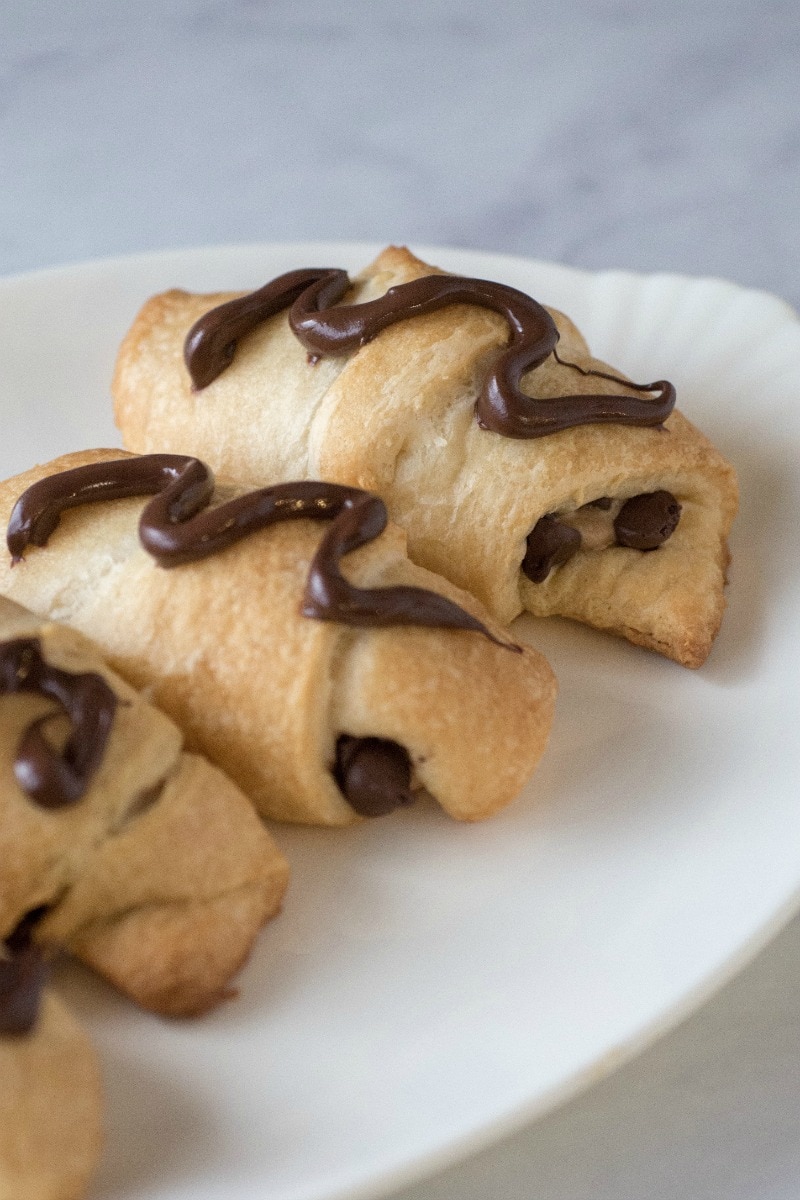 Plate of cresent rolls filled with chocolate and peanut butter