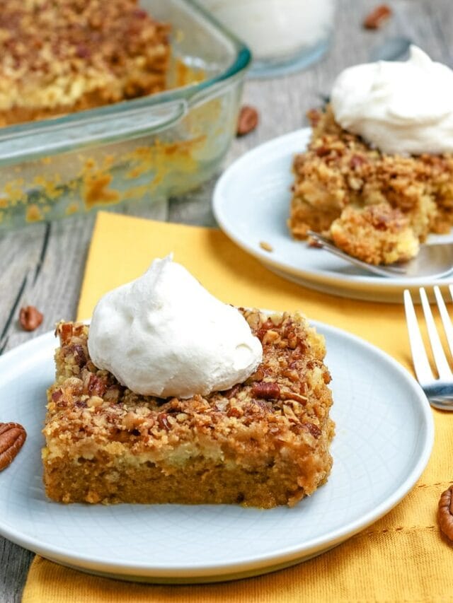 dump cake with slices cut out and topped with whipped cream