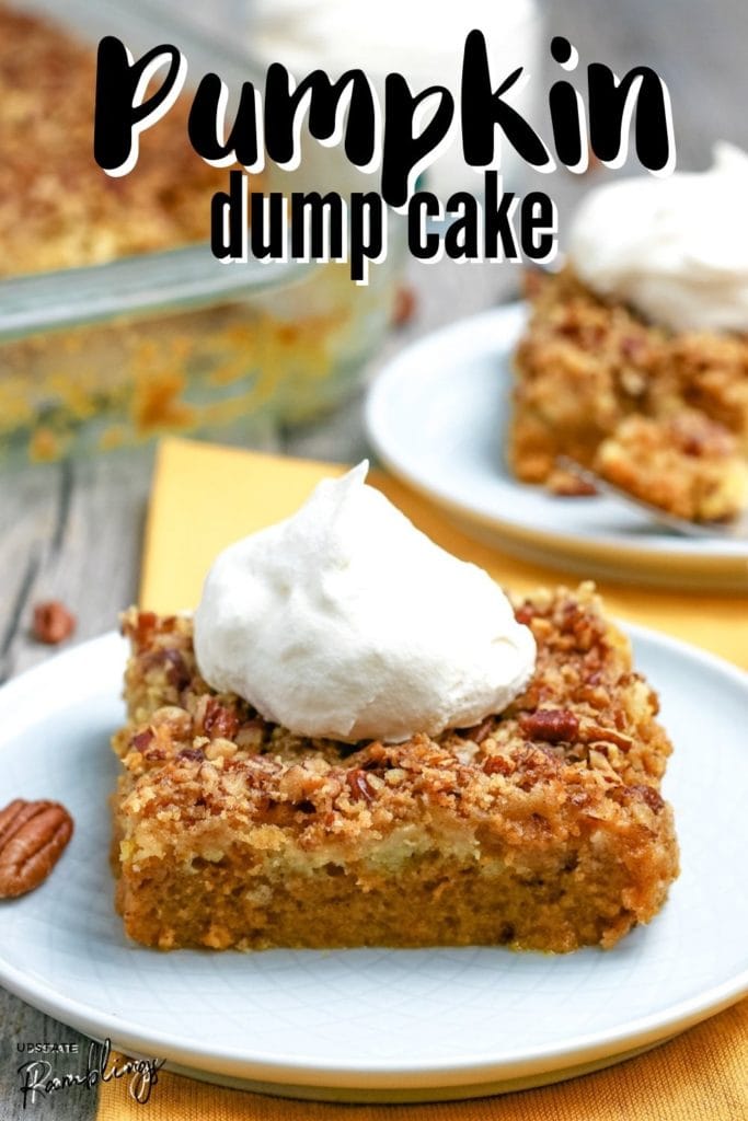 slice of pumpkin dump cake on a plate with whipped cream