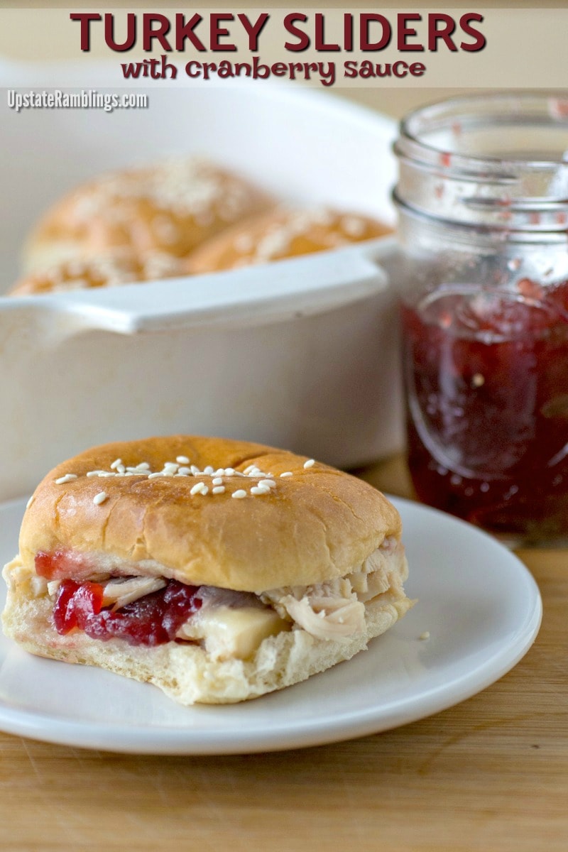 These quick and easy Turkey Sliders are an idea way to use up Thanksgiving leftovers! They are made with only four basic ingredients and include tart cranberry sauce along with gooey cheese to make a hot turkey sandwich the entire family will enjoy. #thanksgiving #turkey #sliders #leftovers