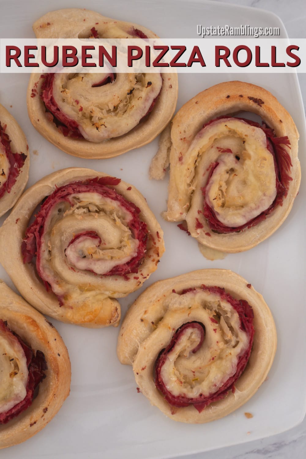 These Reuben Pizza Rolls are a quick and easy Irish inspired recipe in which corned beef, Swiss cheese and sauerkraut are rolled up inside pizza dough for a St. Patrick's Day twist! This simple five ingredient recipe is ready to eat in less than 30 minutes. #reuben #pizzaroll