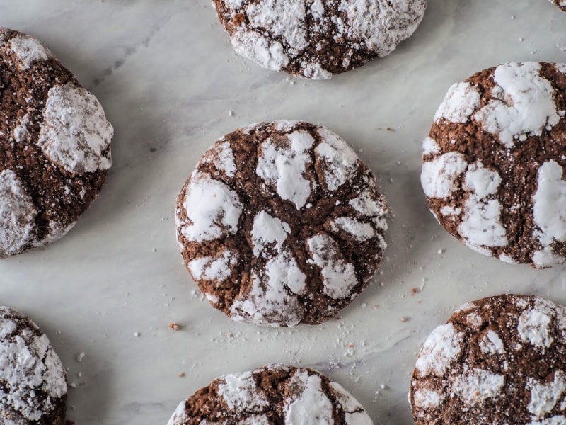 Chocolate Crinkle cookies on a marble counter top
