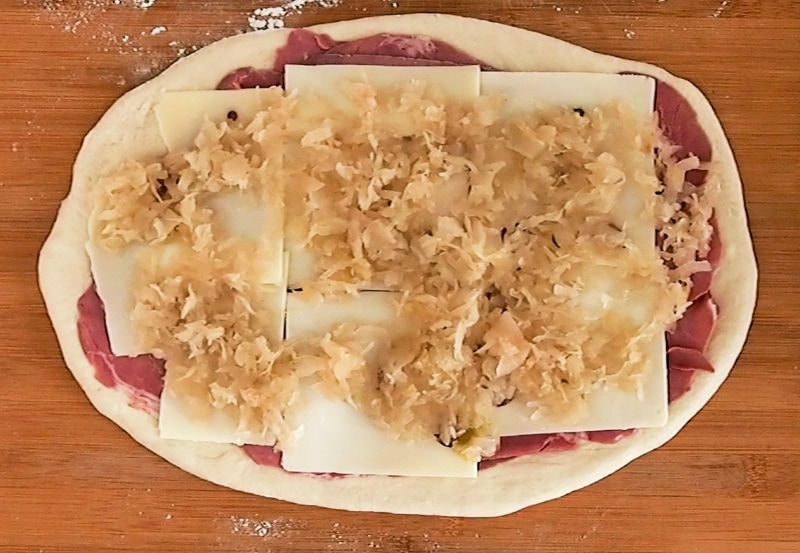 Making the reuben pizza roll - sauerkraut