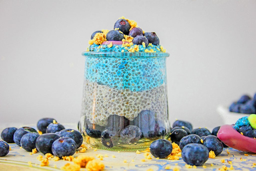 Glass jar with layers of blueberries and chia pudding