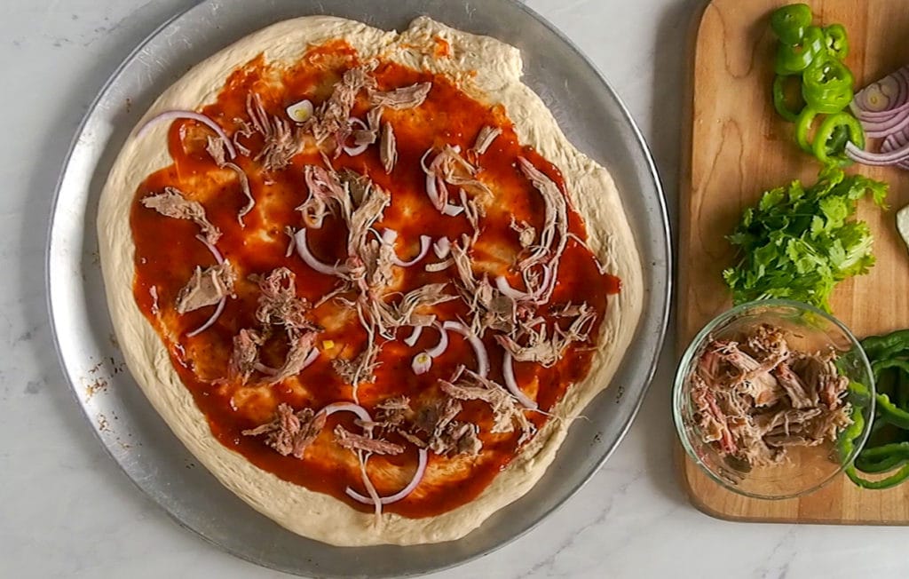 pizza covered with pulled pork