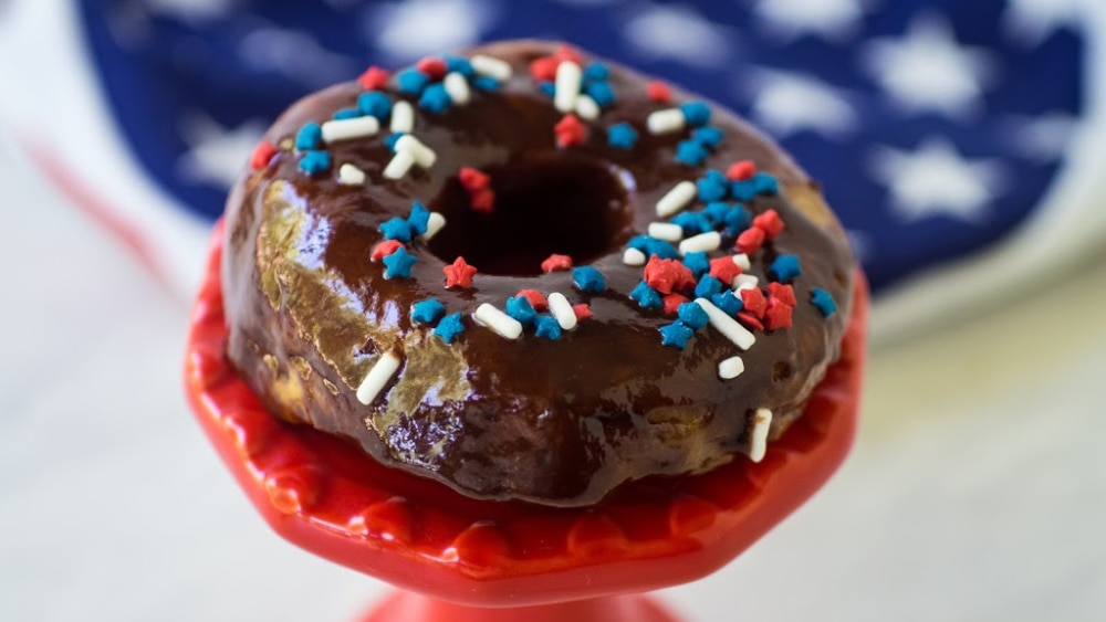 chocolate donut decorated with patriotic sprinkles