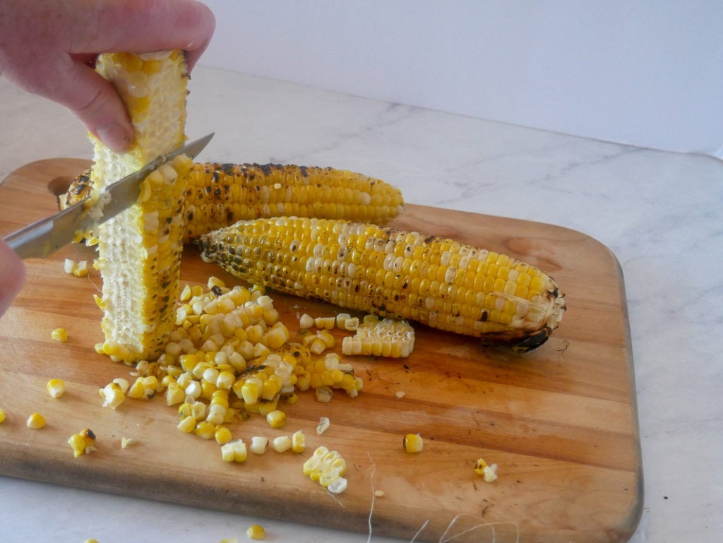cutting the corn off the cob