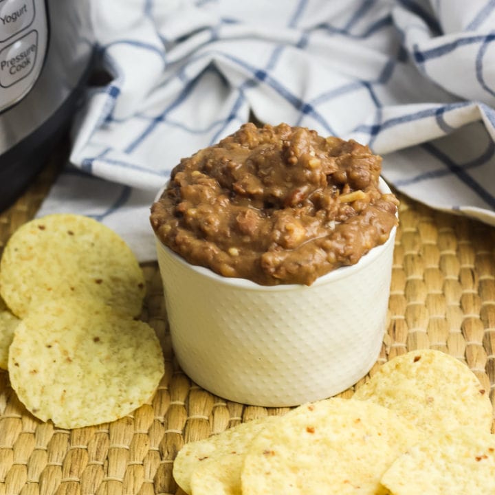 Pressure cooker refried beans in a white bowl