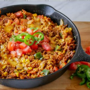 taco skillet dinner - beef, tomatoes, cheese, rice and beans