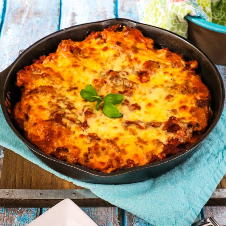 easy stuffed baked manicotti in a cast iron skillet