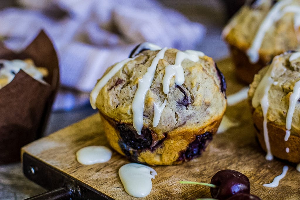 single cherry muffin on a cutting board