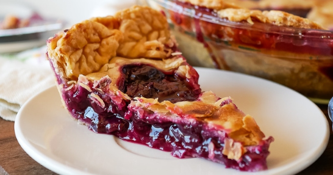 close up of grape pie on a plate