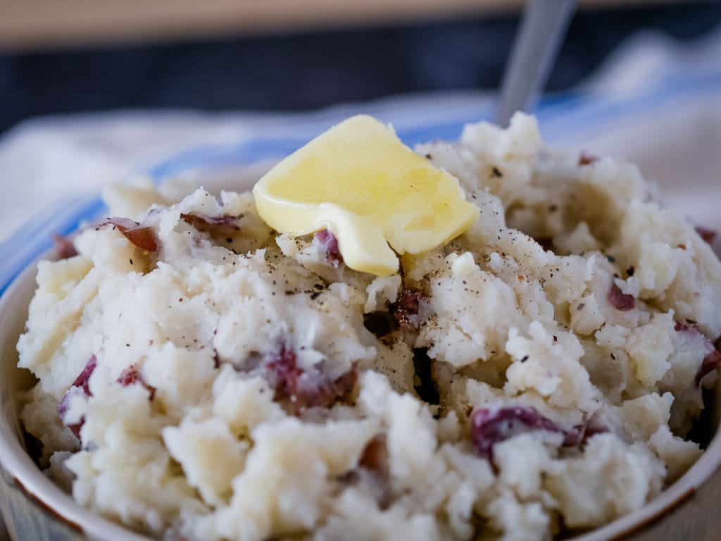 closeup of Instant Pot garlic mashed potatoes with butter