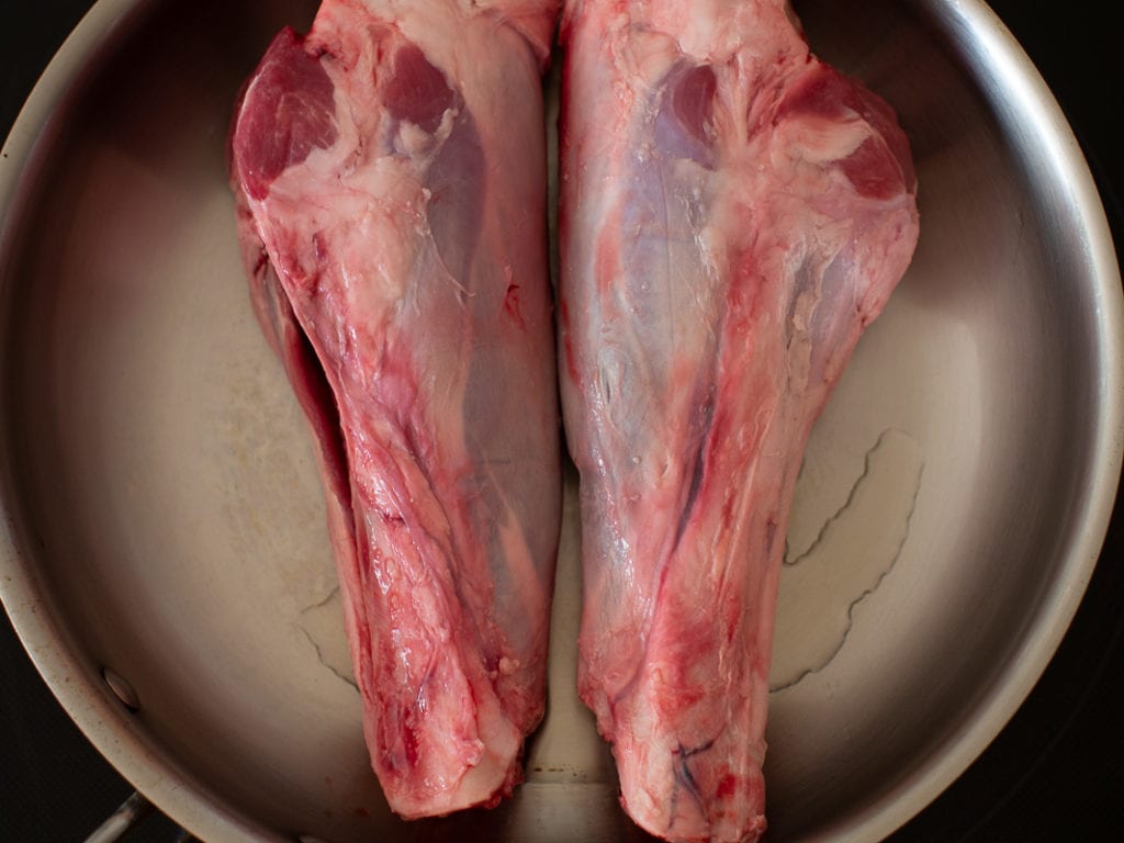 browning lamb shanks in frying pan
