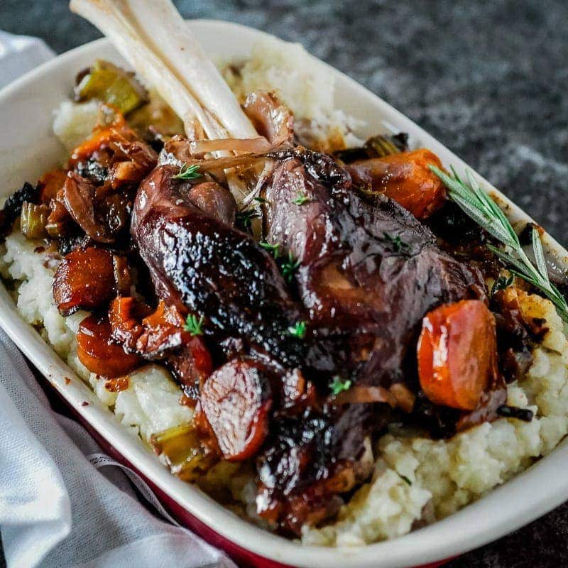 Instant pot lamb shank recipe with mashed potatoes and carrots.