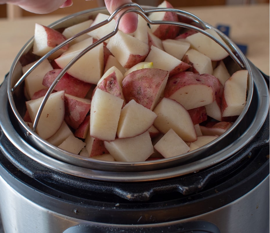 chopped red potatoes in instant pot steamer basket