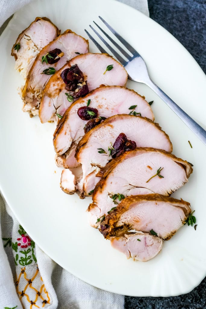 top view of turkey breast sliced on a platter