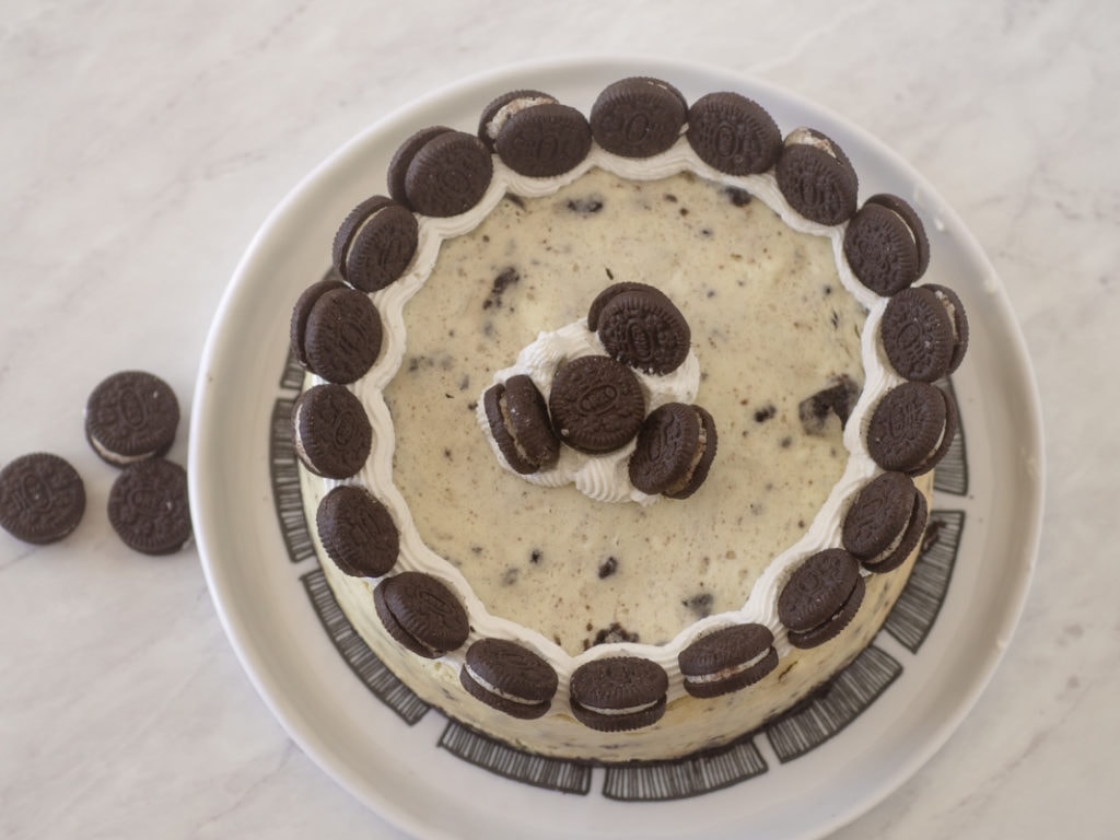 top view of Oreo cheeseake with frosting and mini Oreos