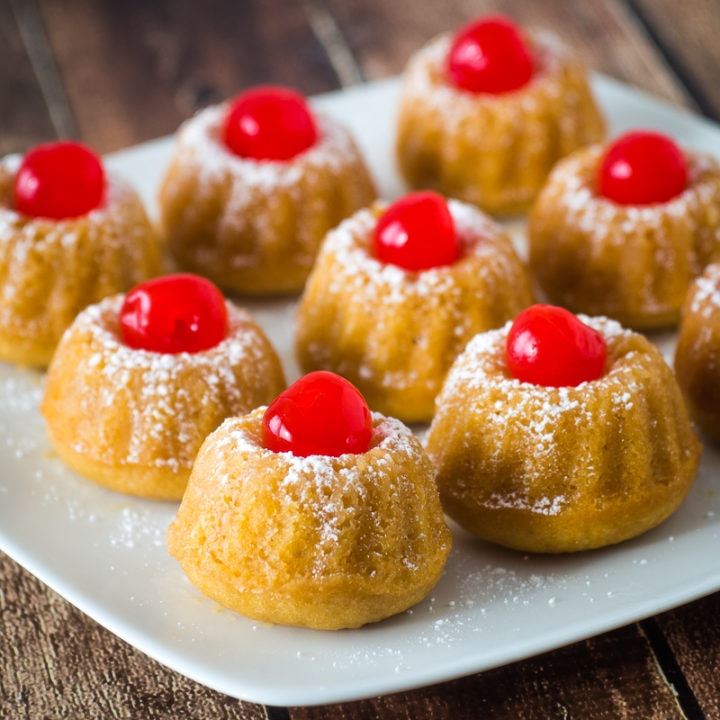 mini rum cakes on a square white plate