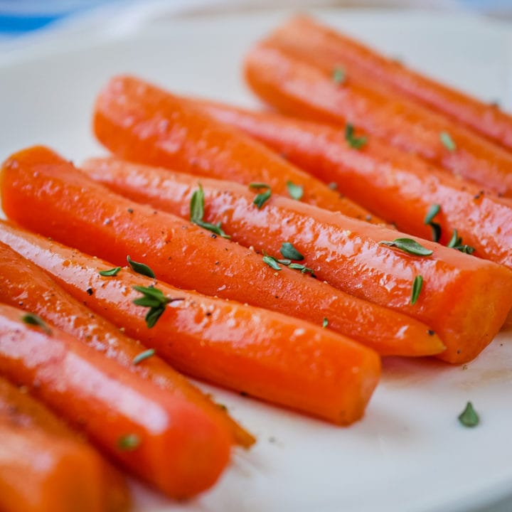 close up of maple bourbon carrots on a plate
