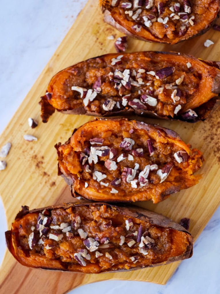 overhead picture of twice baked sweet potatoes topped with pecans