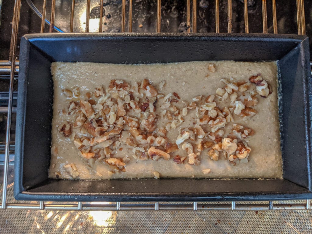 adding walnuts on banana bread