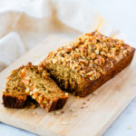 banana bread ready for eating on wooden cutting board