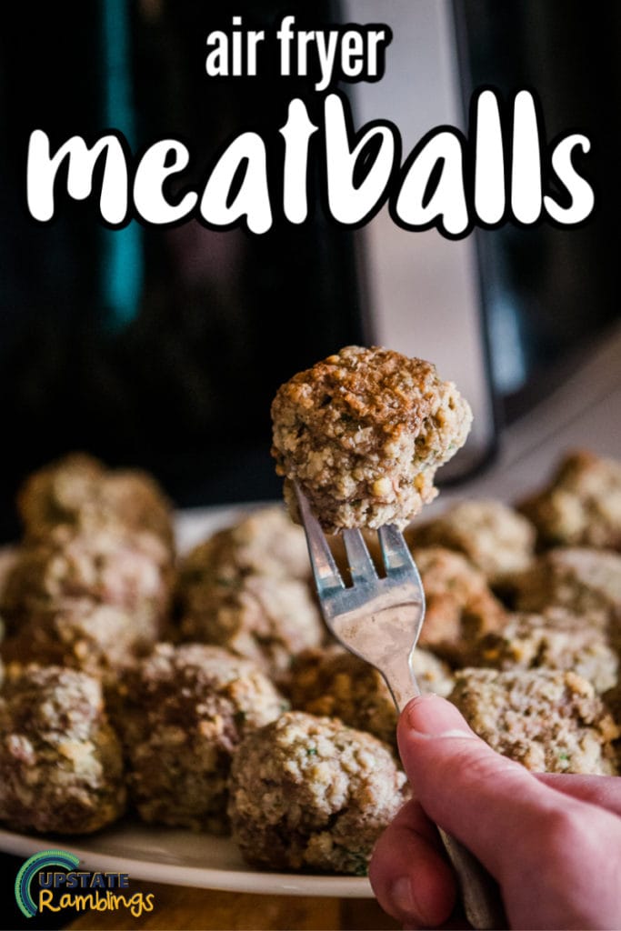 meatball on a fork in front of air fryer