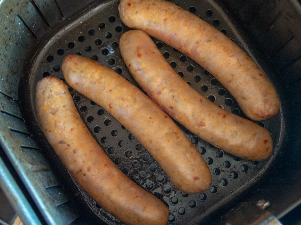 Italian sausage in an air fryer basket