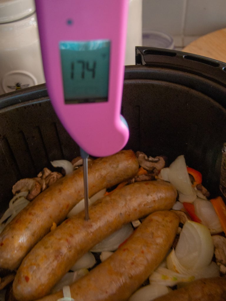 checking the temperature of sausage in t he air fryer