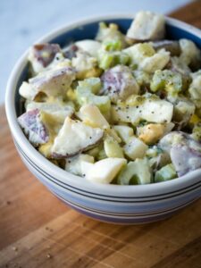 bowl of Instant pot potato salad from a 45 degree angle