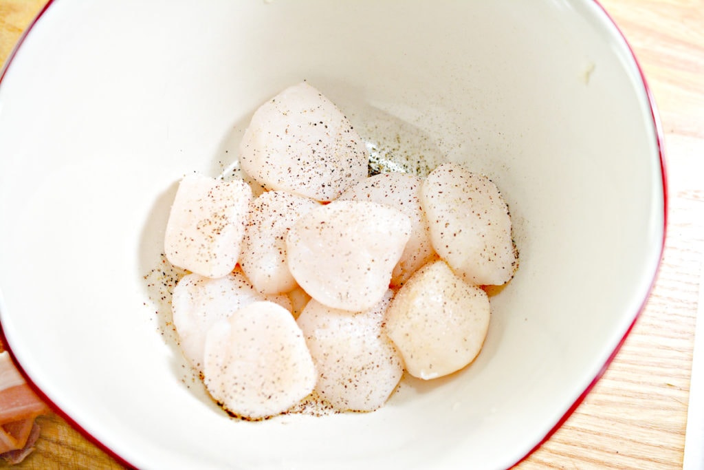 scallops in a bowl with spices