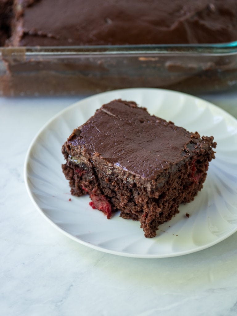 slice of chocolate cherry cake on a plate