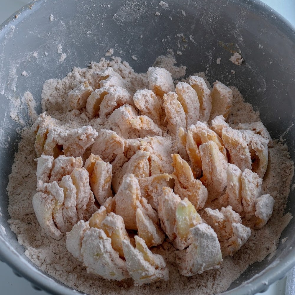 A bowl filled with flour and sugar, perfect for baking.
