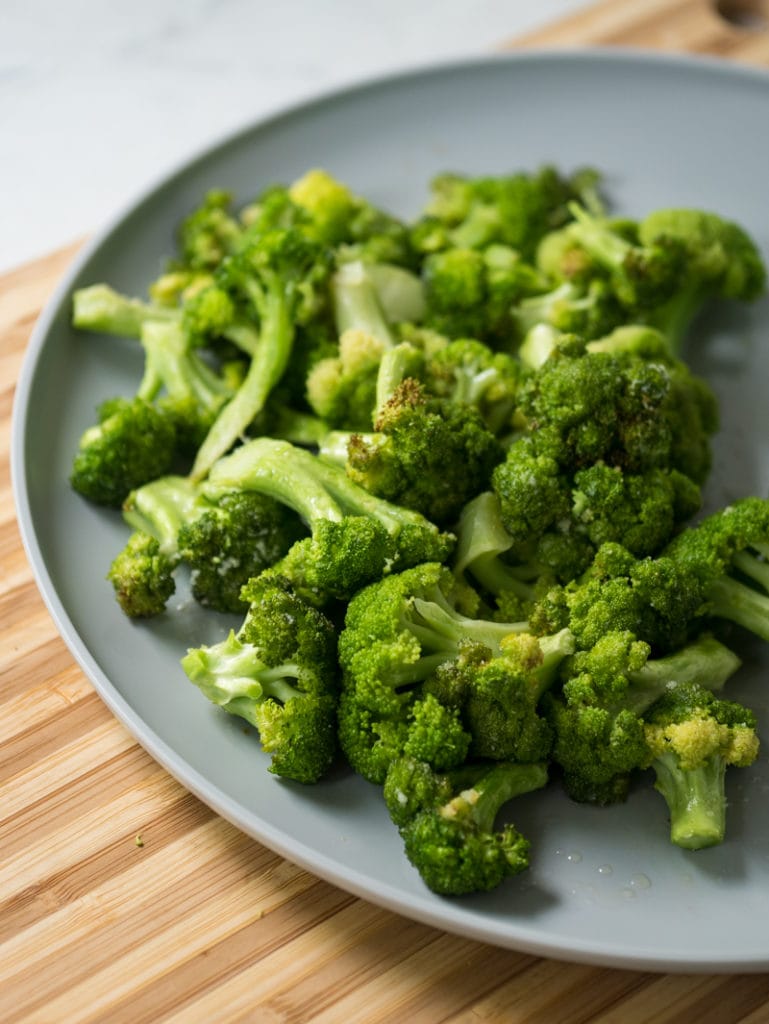 air fryer broccoli on a blue plate