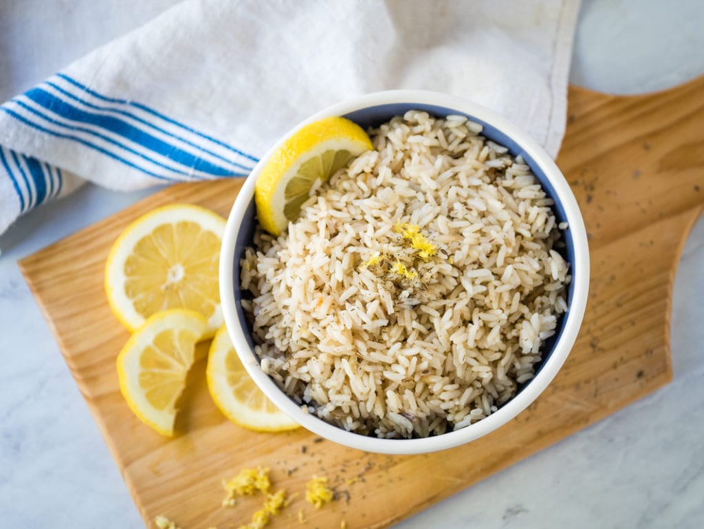 top view of Instant Pot lemon rice garnished with lemons