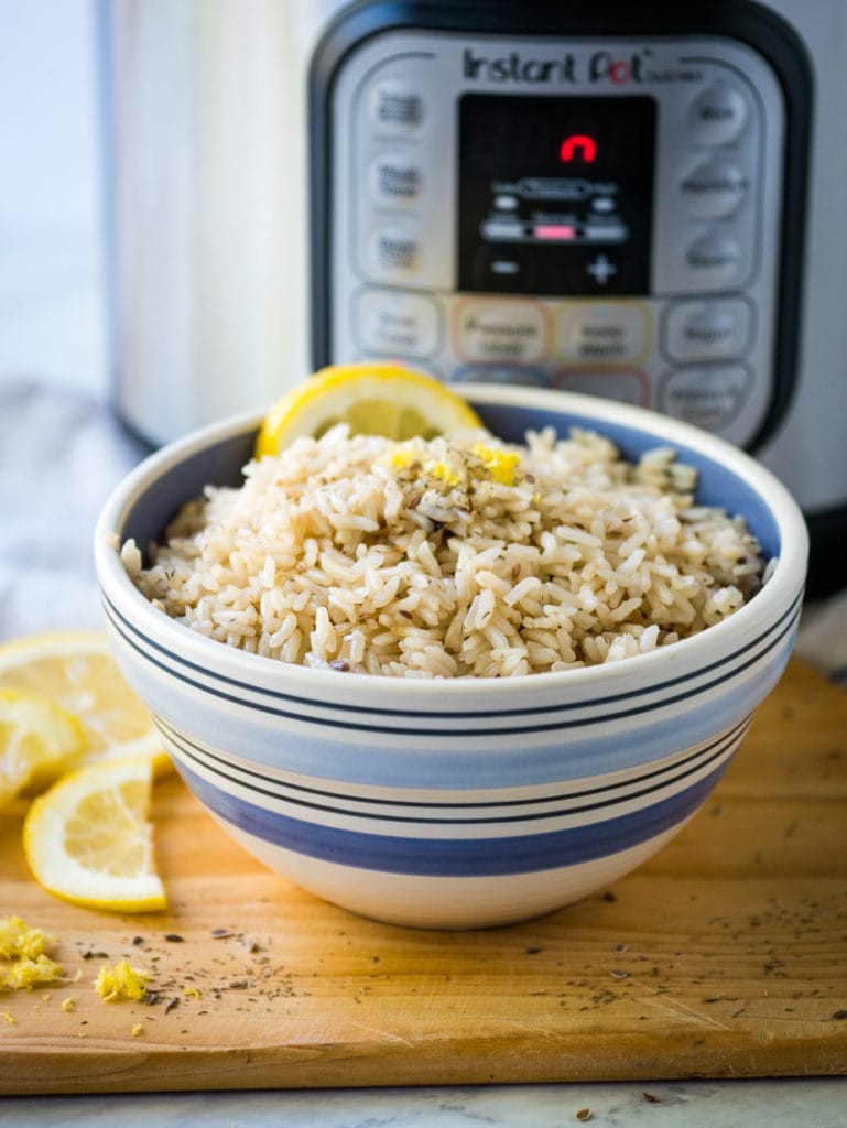 Lemon rice with pressure cooker in the background