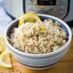 lemon rice in a bowl in front of the Instant Pot