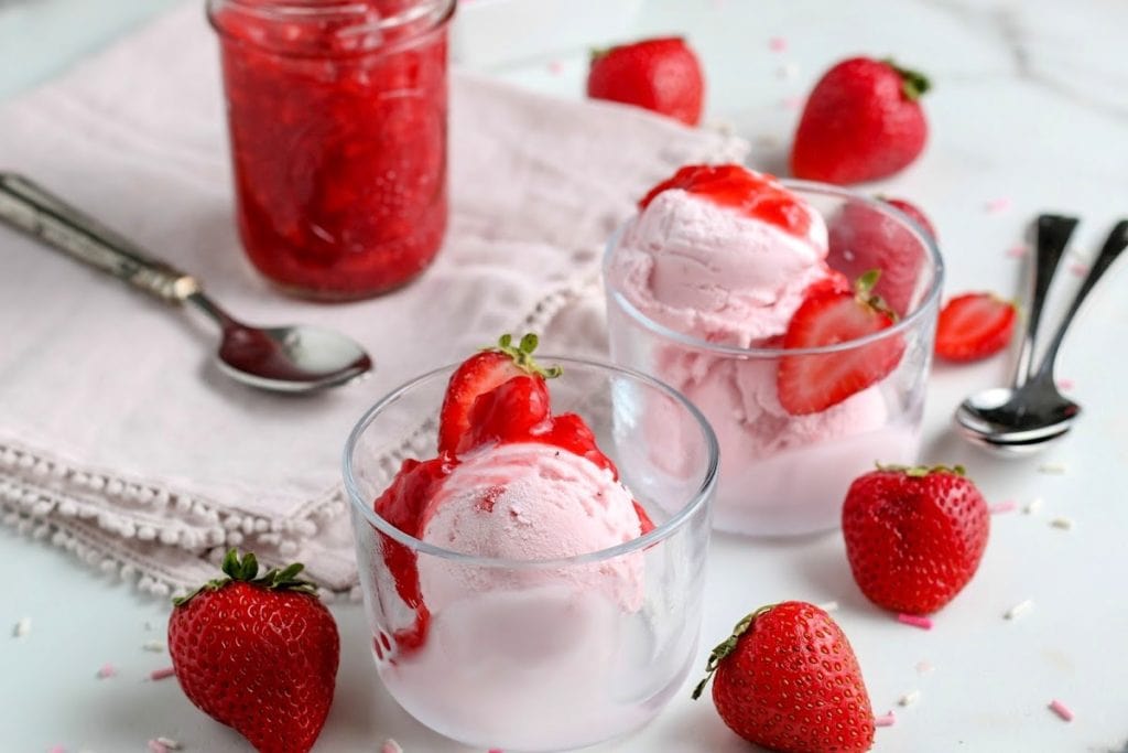 ice cream topped with homemade strawberry sauce