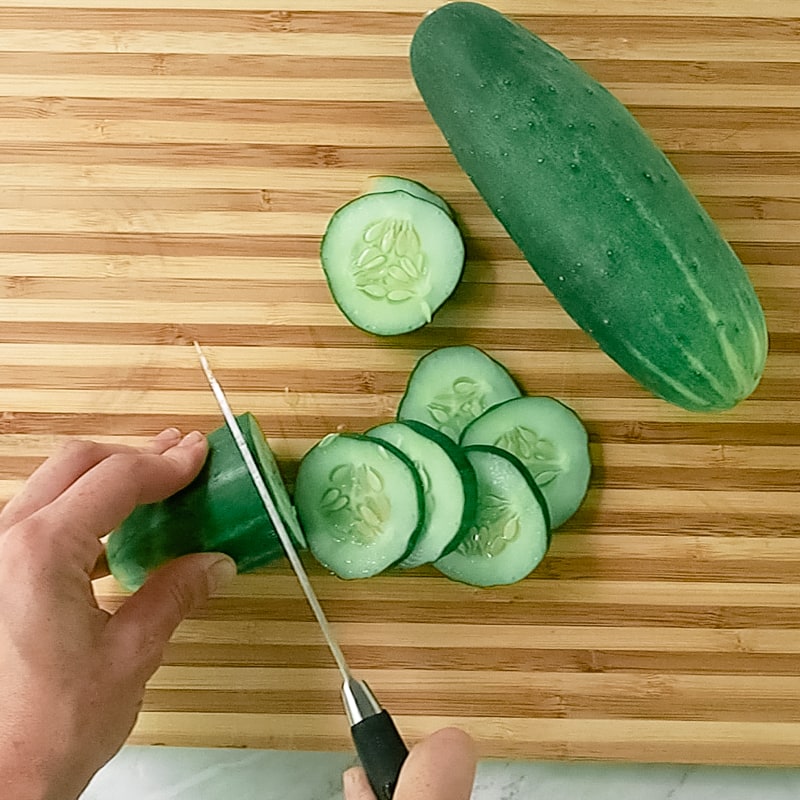 slicing cucumbers into pickles