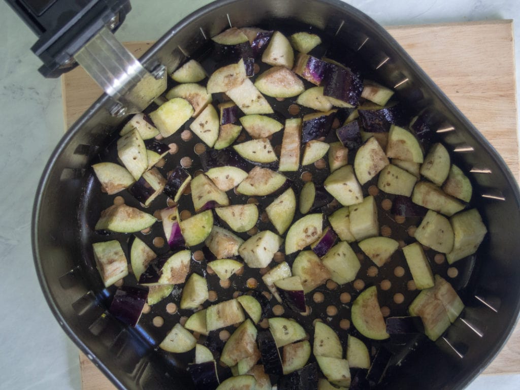 eggplant in air fryer basket before cooking