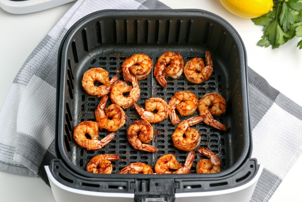shrimp in air fryer basket after cooking
