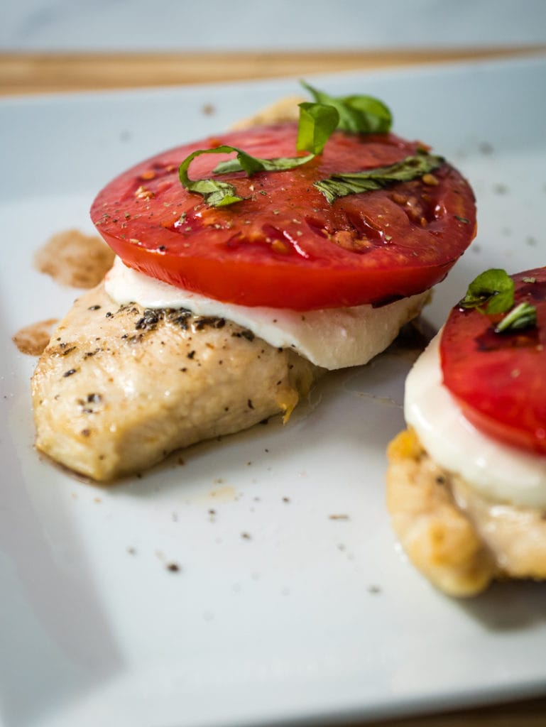 air fryer chicken caprese topped with basil
