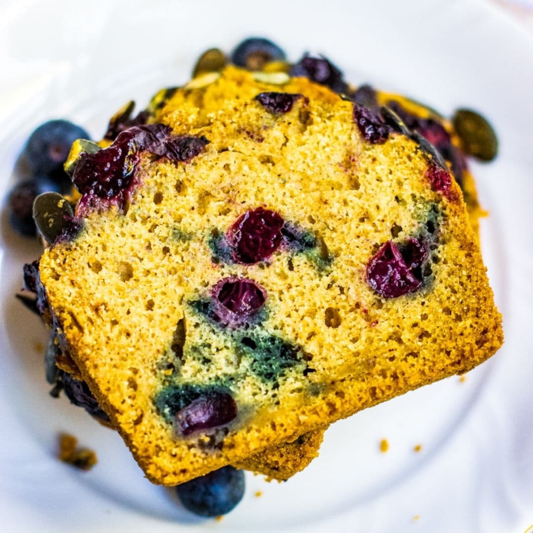 slice of pumpkin bread with blueberries on a plate
