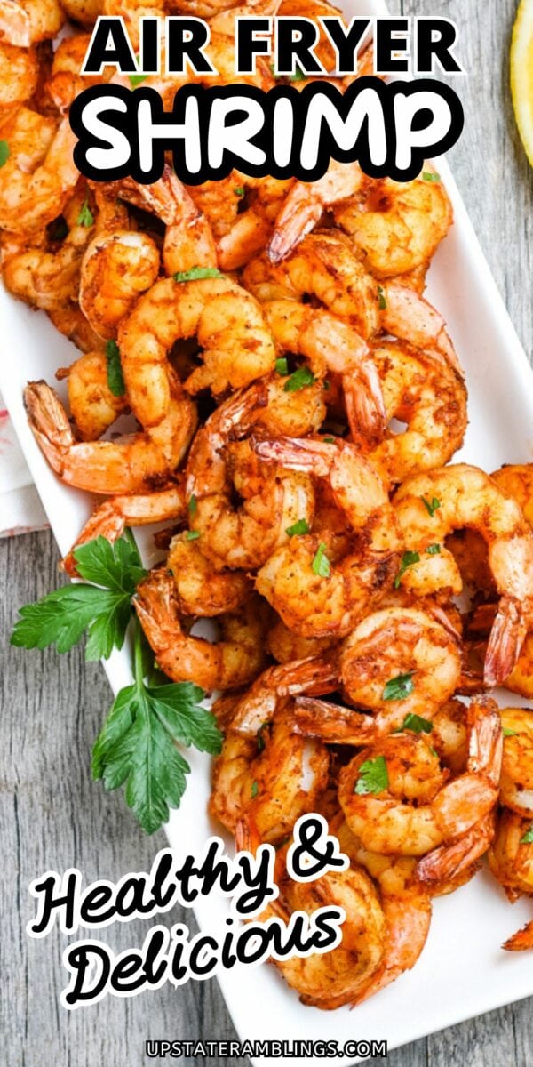 A white tray filled with cooked, seasoned shrimp garnished with herbs is shown. Text on the image reads, "Air Fryer Shrimp - Healthy & Delicious." Enjoy the perfect blend of flavor and convenience with air fryer shrimp.