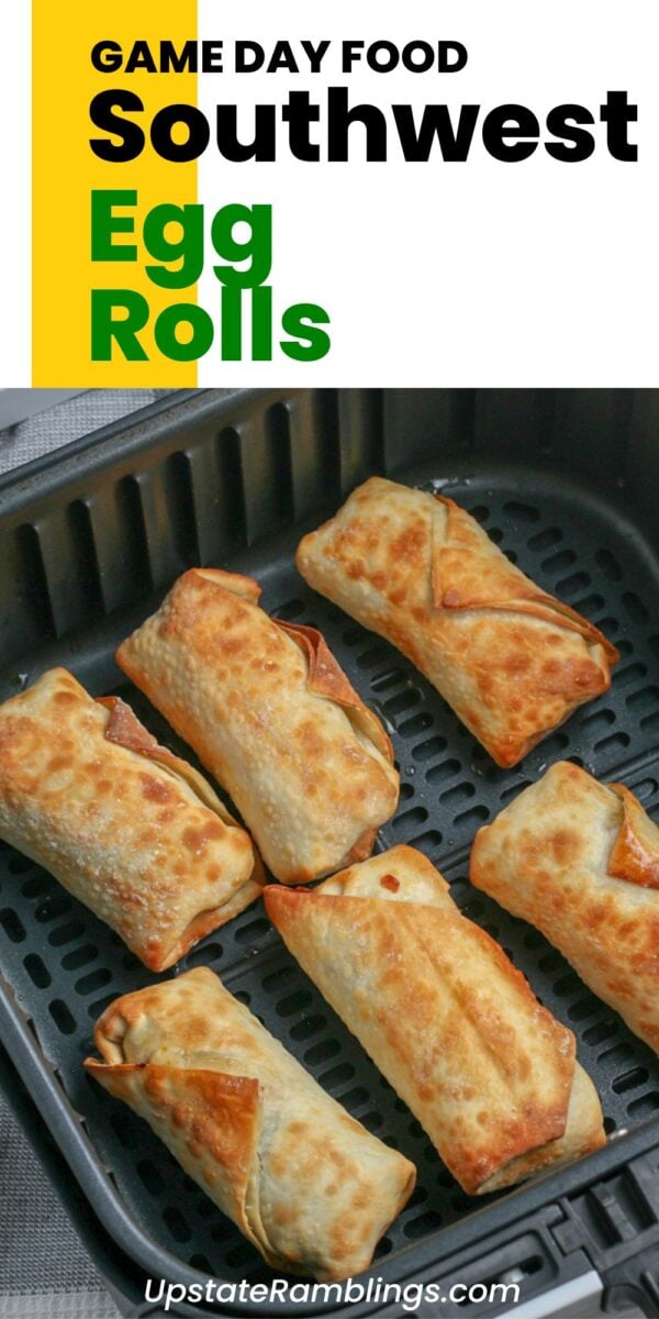 Six golden-brown southwest egg rolls cook in an air fryer basket, labeled as Game Day Food: Southwest Egg Rolls.